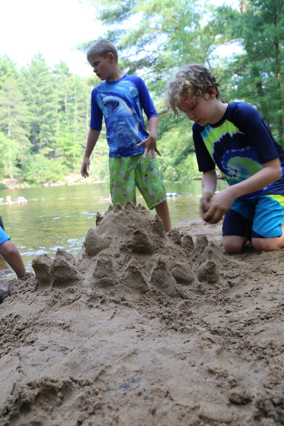 campers building sand castle