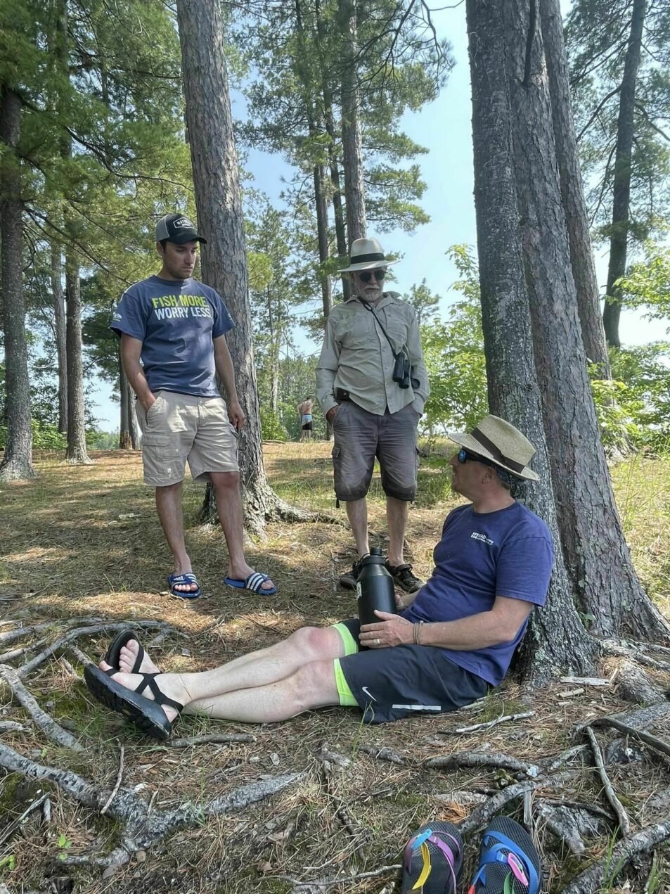 camp leaders chatting in forest