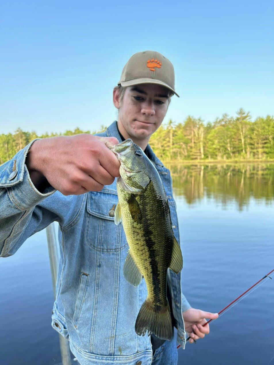 camper holding fish